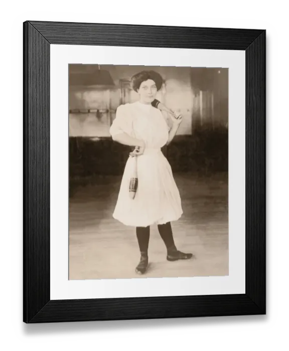 Framed Print : Young woman holding exercise pins (B&W sepia tone) Framed Print : Young woman holding exercise pins (B&W sepia tone)