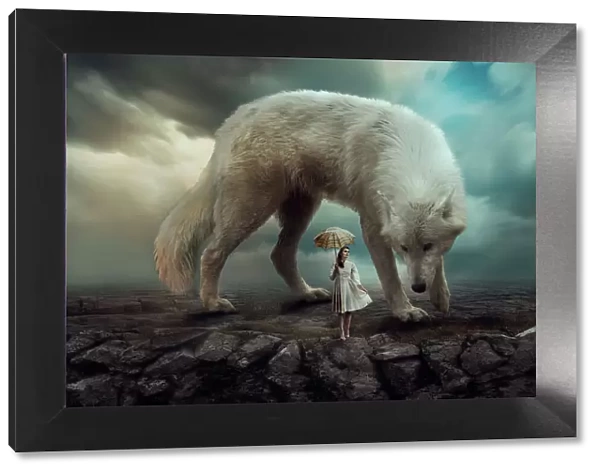 Girl with an umbrella stands on a rock with a huge wolf against a dramatic sky