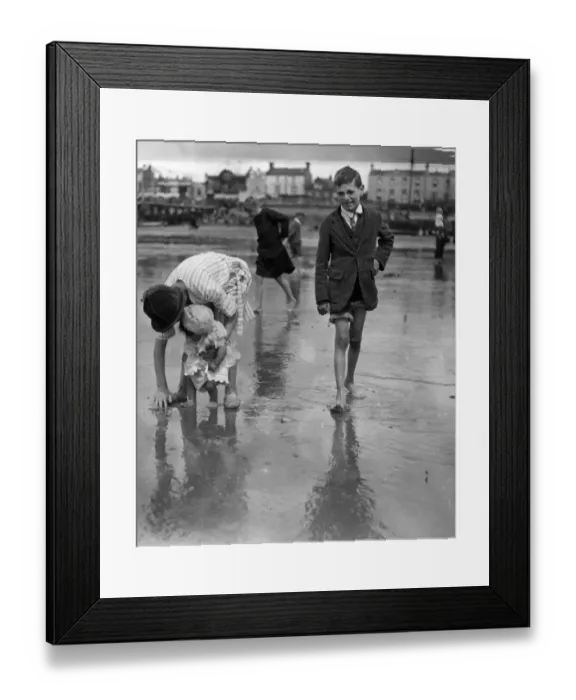 Framed Print : First Dip. June 1925: Children having fun on the beach at Southend Framed Print : First Dip. June 1925: Children having fun on the beach at Southend