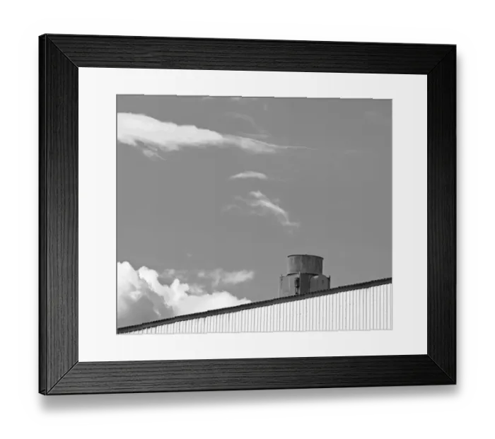 Framed Print : Gray Vent. A black and white photograph of the roof of a metal sided commercial Framed Print : Gray Vent. A black and white photograph of the roof of a metal sided commercial