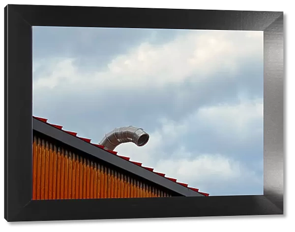 Sky Duct. A color photograph of the roof to a metal commercial building