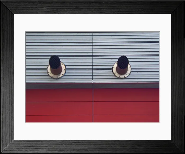 Framed Print : Red Clone. A color photo of two ventilation pipes jutting out Framed Print : Red Clone. A color photo of two ventilation pipes jutting out