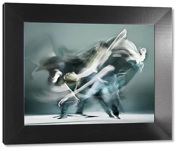 Duet. The image shows a continuous flow a two dancers in a fierce duet