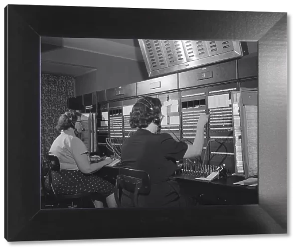 Two women wearing headsets, working on telephone switchboard. (Photo by H. Armstrong Roberts / Retrofile / Getty Images)
