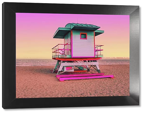 Dreamlike picture of colorful lifeguard cabin in the Miami beach at sunset