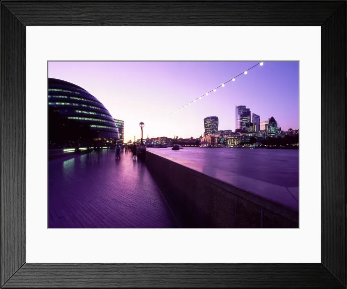 Framed Print : Riverbank and the city skyline of London at dusk Framed Print : Riverbank and the city skyline of London at dusk