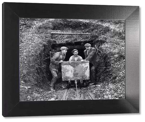 Miners. circa 1930: Miners bring out coal out