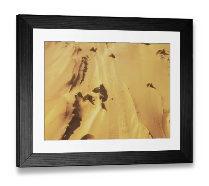 Framed Print : Aerial view of white car on desert road Framed Print : Aerial view of white car on desert road