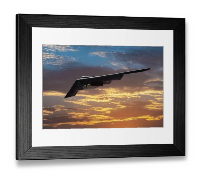 Framed Print : Inflight view of a USAF Northrop Grumman B-2A Spirit stealth bomber in a sunset Framed Print : Inflight view of a USAF Northrop Grumman B-2A Spirit stealth bomber in a sunset