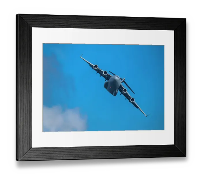 Framed Print : McDonnell Douglas / Boeing C-17 Globemaster III American Air Force cargo plane flying against sky