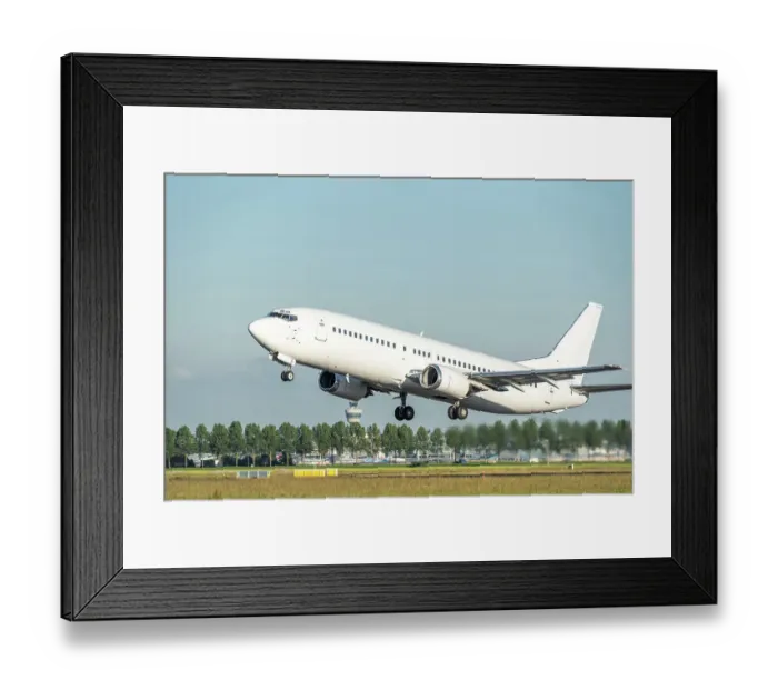 Framed Print : A white Boeing 737 airplane taking off Framed Print : A white Boeing 737 airplane taking off