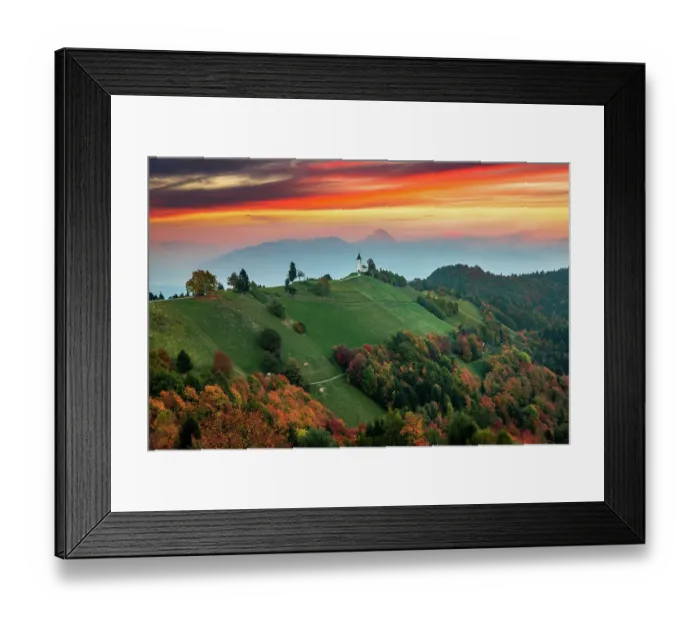 Framed Print : Sunset landscape of church Jamnik in Slovenia on green hill with mountains background Framed Print : Sunset landscape of church Jamnik in Slovenia on green hill with mountains background