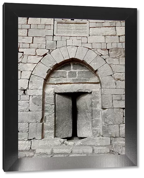 Stone door at Qasr al Azraq, Latin Basianis, Basienis, or Amatha, Blue Fortress, a historic Roman and Byzantine military camp on the anterior Limes Arabiae et Palaestinae, Desert Castle, Azraq, Jordan