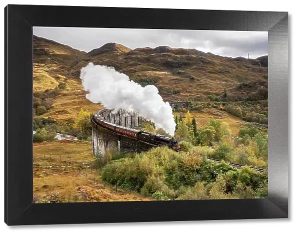 The Jacobite Steam train Crossing the Glenfinnan Viaduct in Scotland