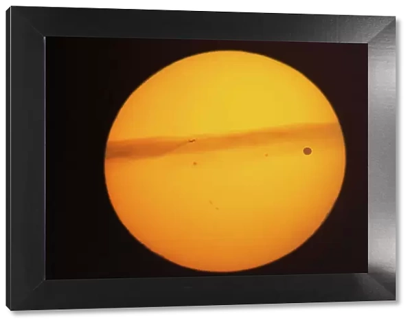 Rare transit of the planet Venus across the face of the sun that took place on June 5, 2012. The sun was close to the horizon and in addition to the silhouette of Venus