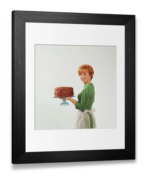 Framed Print : Woman holding cake, smiling, portrait Framed Print : Woman holding cake, smiling, portrait