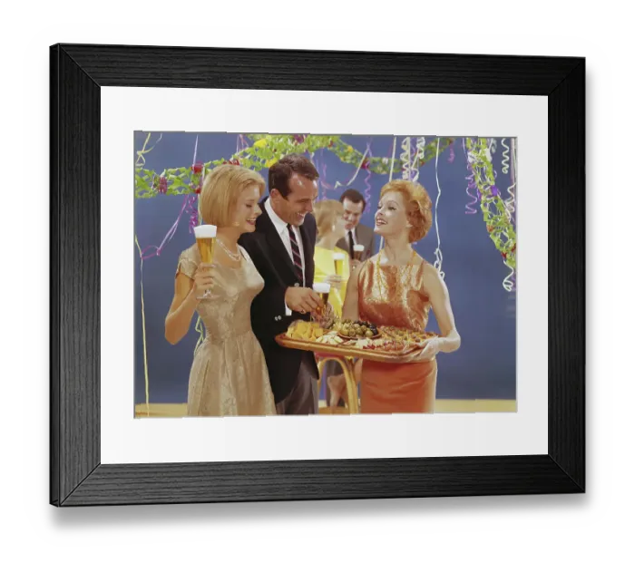 Framed Print : Woman serving appetizers at party, smiling Framed Print : Woman serving appetizers at party, smiling