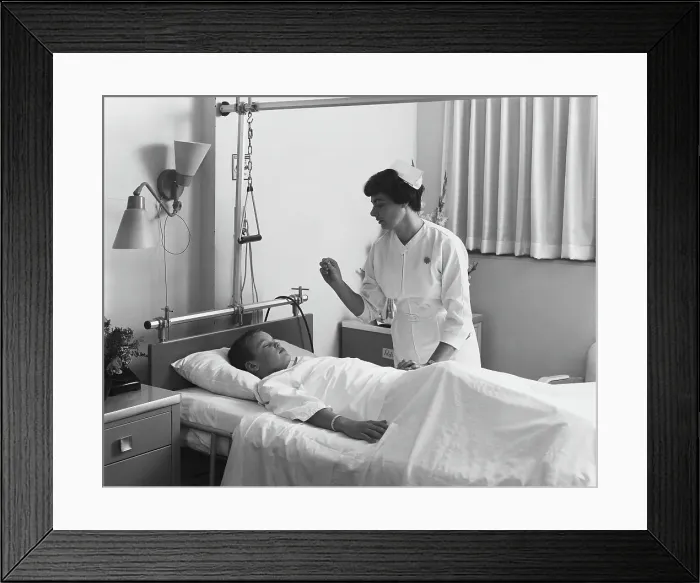Framed Print : Female nurse checking boy's temperature Framed Print : Female nurse checking boy's temperature