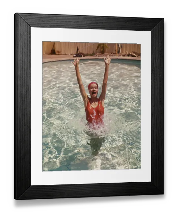 Framed Print : Young woman in swimming pool, portrait Framed Print : Young woman in swimming pool, portrait