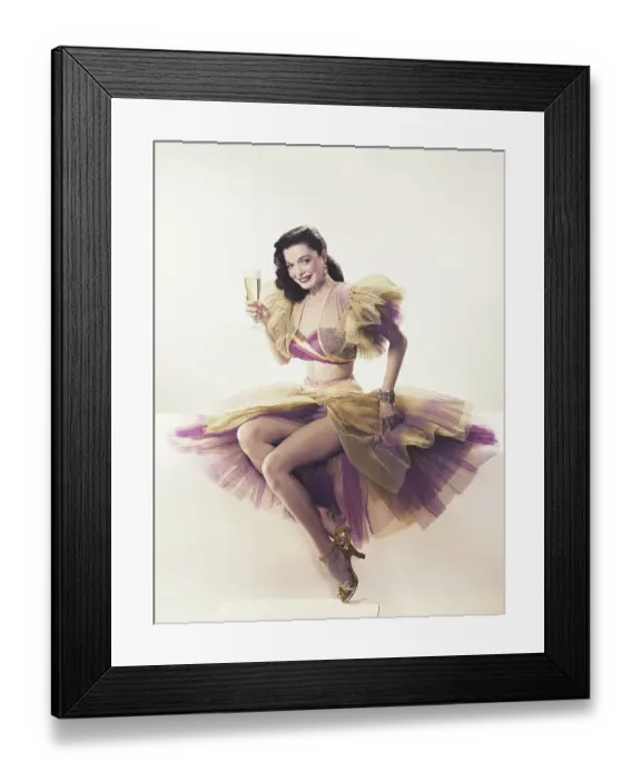 Framed Print : Young woman in ruffled dress holding beer glass, portrait Framed Print : Young woman in ruffled dress holding beer glass, portrait