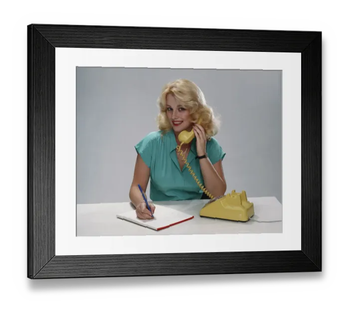 Framed Print : Young woman talking on phone, smiling, portrait Framed Print : Young woman talking on phone, smiling, portrait