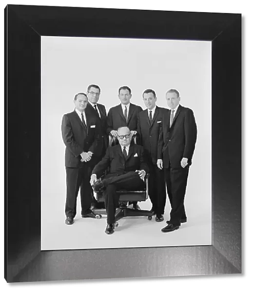 Businessmen against white background, portrait