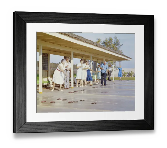 Framed Print : Senior people playing shuffleboard Framed Print : Senior people playing shuffleboard