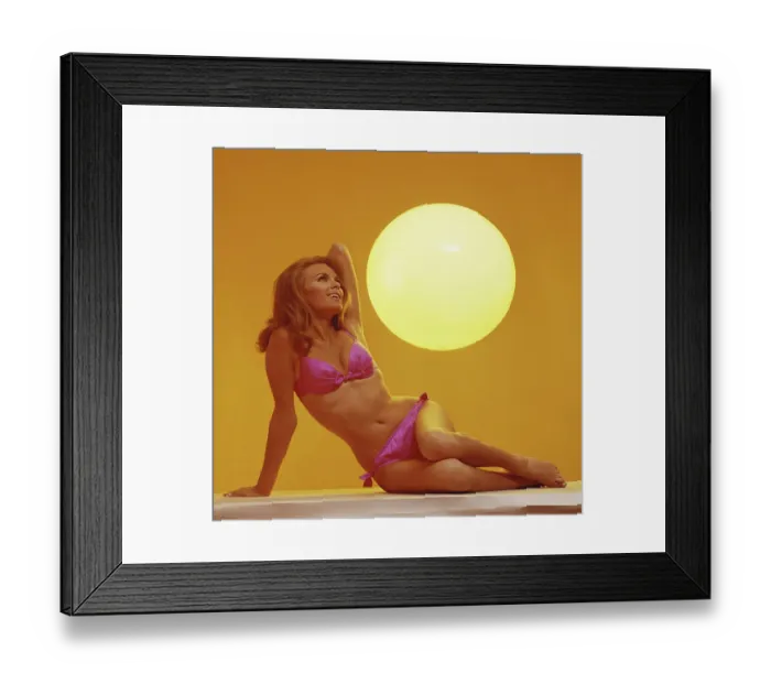 Framed Print : Young woman smiling with sun in background Framed Print : Young woman smiling with sun in background