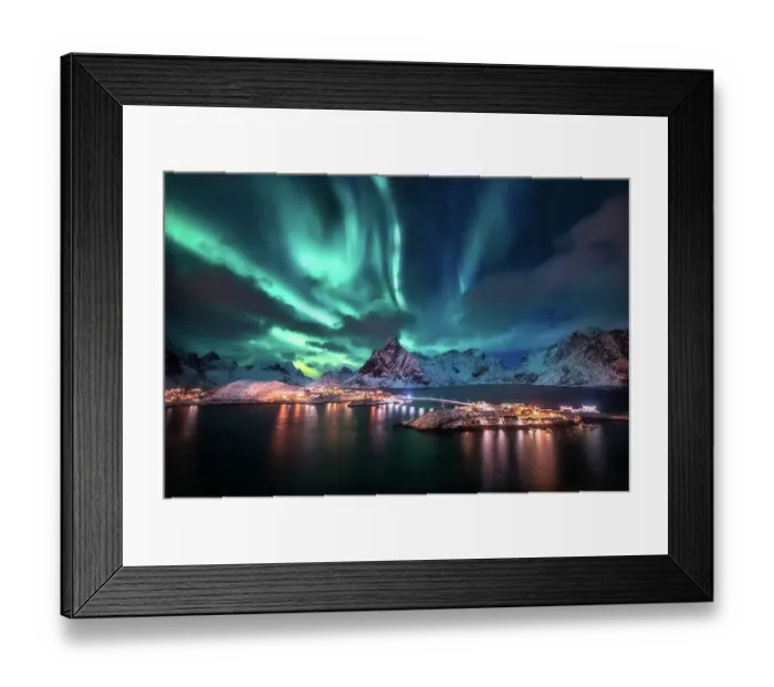 Framed Print : Aurora borealis. Lofoten islands, Norway. Aurora. Green northern lights. Starry sky with polar lights. Night winter landscape with aurora, sea with sky reflection and snowy mountains