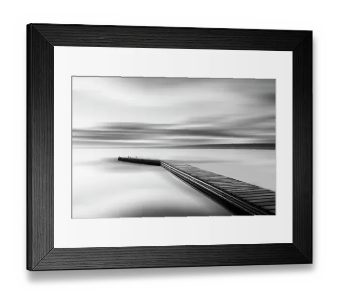 Framed Print : Jetty. Sea coast and jetty at sunrise leading out into still waters Framed Print : Jetty. Sea coast and jetty at sunrise leading out into still waters