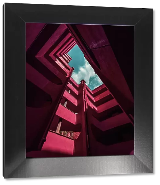 Red architecture with different levels and stunning design seen from below