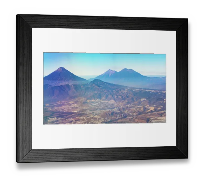 Framed Print : Aerial View of Volcanoes and Part of the Nearby City - Guatemala - Central America Framed Print : Aerial View of Volcanoes and Part of the Nearby City - Guatemala - Central America