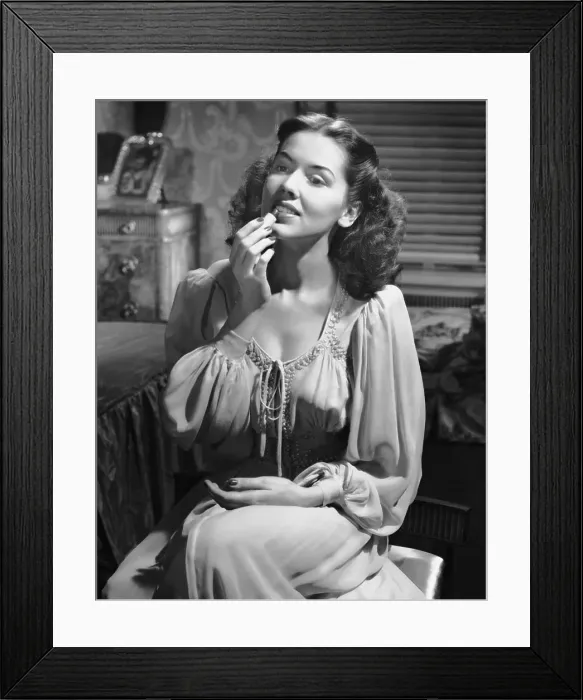 Framed Print : Woman applying lipstick Framed Print : Woman applying lipstick
