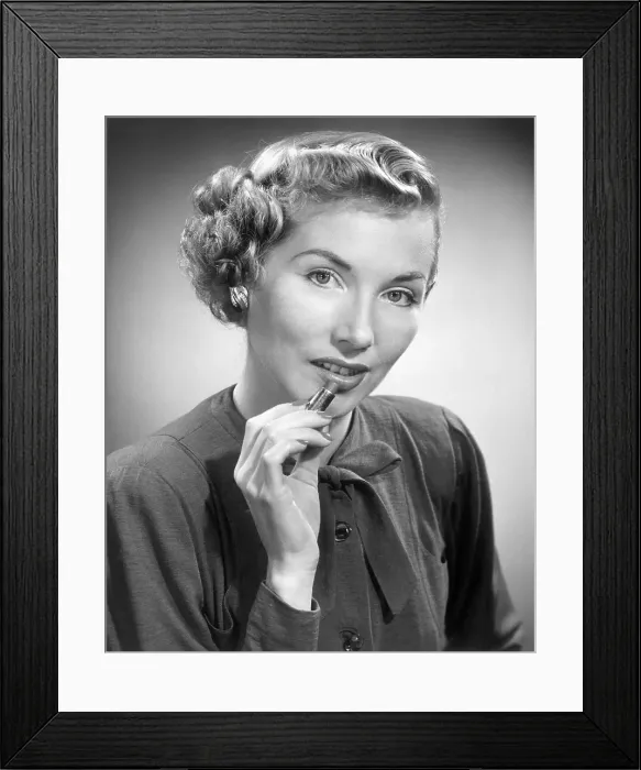 Framed Print : Woman putting on lipstick Framed Print : Woman putting on lipstick