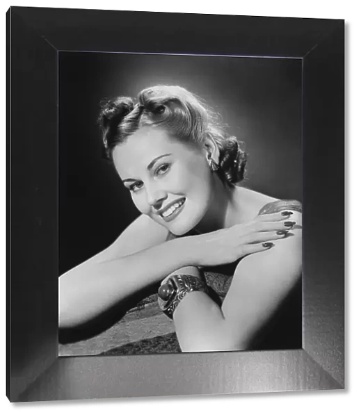 Glamorous woman posing in studio, (B&W), portrait, close-up