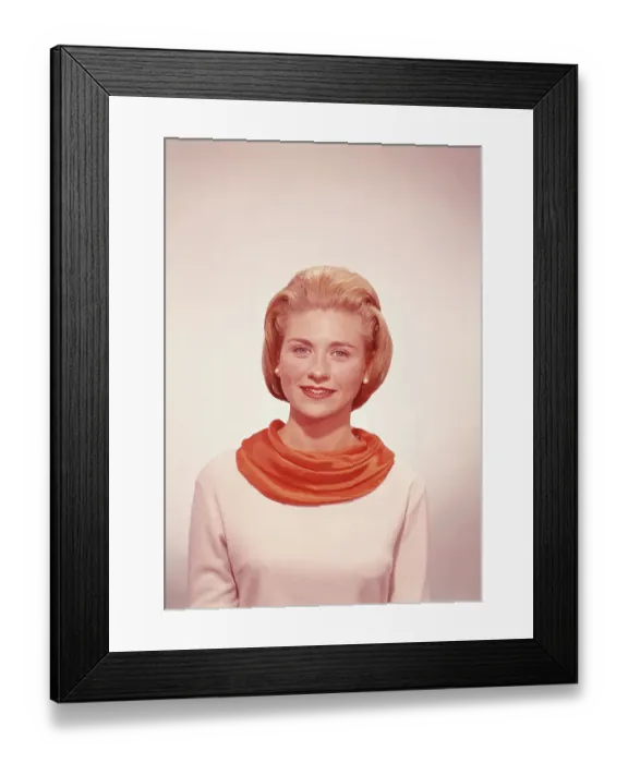 Framed Print : Young woman wearing scarf in studio, smiling Framed Print : Young woman wearing scarf in studio, smiling