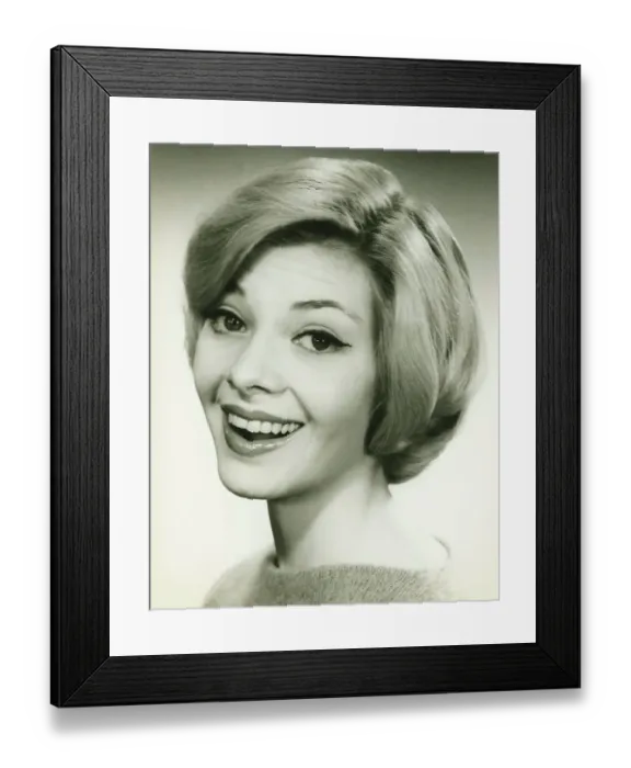 Framed Print : Young woman smiling, posing in studio, (B&W), (Portrait) Framed Print : Young woman smiling, posing in studio, (B&W), (Portrait)