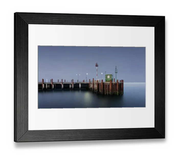 Framed Print : Long exposure of the illuminated harbour watchman's house at dusk during the blue hour at the harbour entrance of List on Sylt, Germany, Europe Framed Print : Long exposure of the illuminated harbour watchman's house at dusk during the blue hour at the harbour entrance of List on Sylt, Germany, Europe
