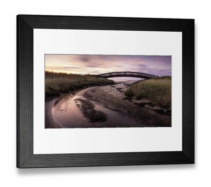 Framed Print : Colourful sunrise behind the Luegenbruecke on the mudflats in the east of the North Frisian island of Sylt, Germany