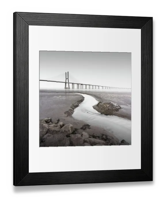 Framed Print : Long exposure of the famous bridge Ponte Vasco da Gama at low tide on the river Tejo with a small water tributary in Lisbon, Portugal
