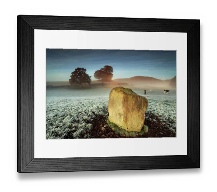 Framed Print : Standing stone on frosty field