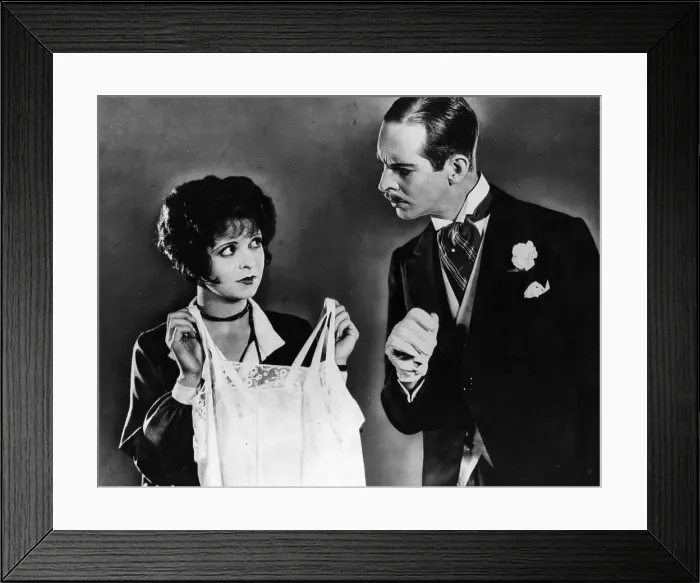 Framed Print : Underwear. circa 1927: Clara Bow holds up some underwear Framed Print : Underwear. circa 1927: Clara Bow holds up some underwear