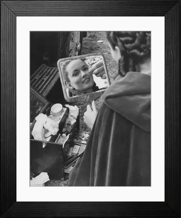 Framed Print : Ann Blyth. A make-up artist works on American actress Ann Blyth on the
