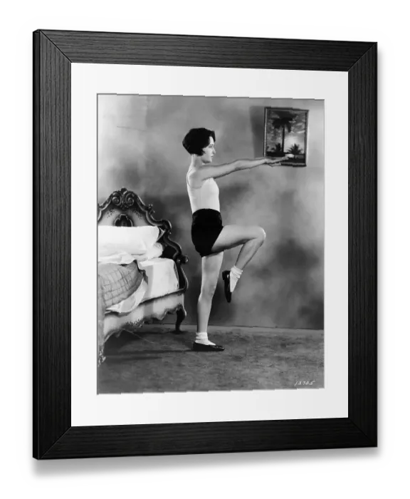 Framed Print : Workout. circa 1930: Deep breathing is stimulated by extending the arms outwards Framed Print : Workout. circa 1930: Deep breathing is stimulated by extending the arms outwards