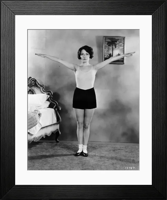Framed Print : Workout. circa 1930: Deep breathing is stimulated by extending the arms outwards
