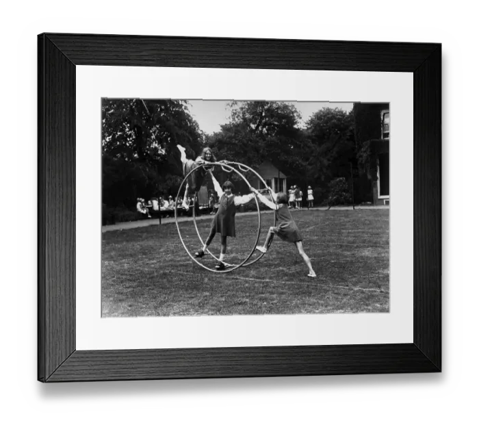 Framed Print : Gyrowheel. July 1929: Gyrowheel gymnastics at a school in Crouch End, London Framed Print : Gyrowheel. July 1929: Gyrowheel gymnastics at a school in Crouch End, London