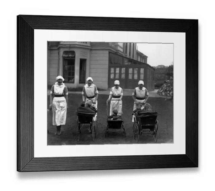 Framed Print : Pram Ride. 1926: A group of nurses stroll with their young charges Framed Print : Pram Ride. 1926: A group of nurses stroll with their young charges
