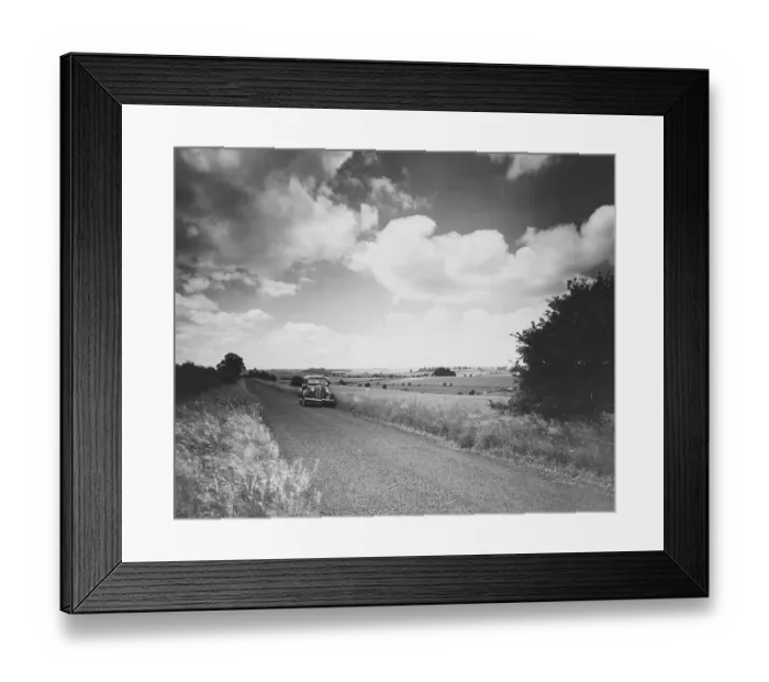 Framed Print : Fosse Way. July 1937: A car on the ancient Fosse Way in the Cotswolds Framed Print : Fosse Way. July 1937: A car on the ancient Fosse Way in the Cotswolds