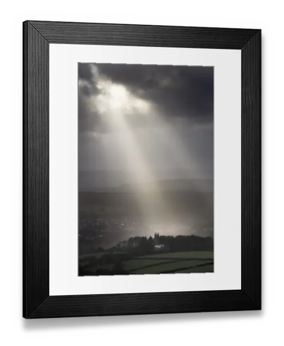 Framed Print : Walkhampton Church lit by sunlight in heavy rain, Walkhampton, Dartmoor, Devon, England