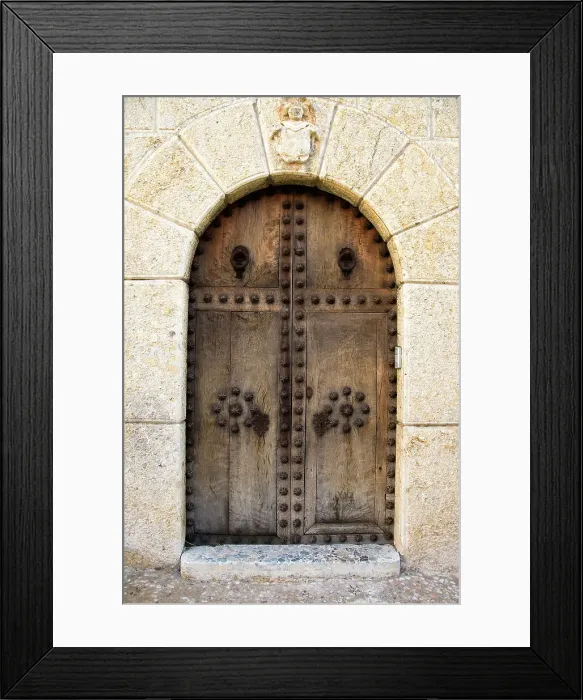 Framed Print : Heavy wooden doors at entrance of building